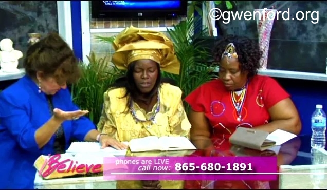 Dr. Gwen Ford (left) praying on set during taping of her 'I BELIEVE' TV Show with her guests from South Africa.